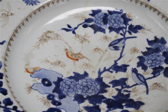 A Chinese grisaille and underglaze blue dish, c.1740, decorated with birds, bamboo, rocks and flowers, label verso from Viscount Bridpo